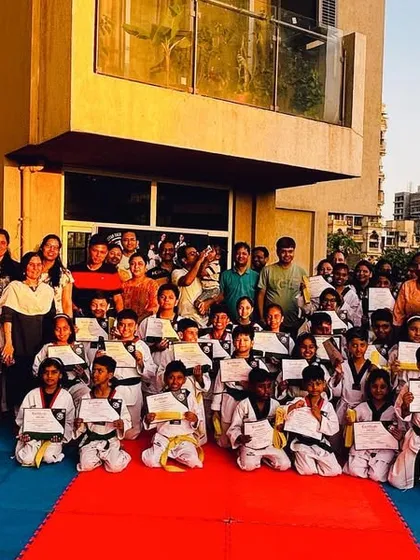 A group photo with students and proud parents after our 2023 belt exam.