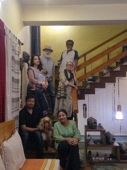 A precious family photo with our hosts and friends at our homestay in Santiniketan.