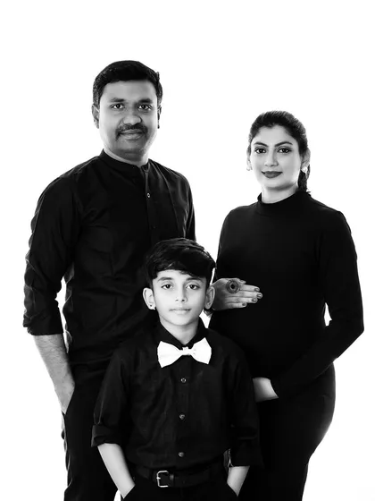 The black and white version of our timeless family maternity portrait, adding a classic and dramatic feel to the image.