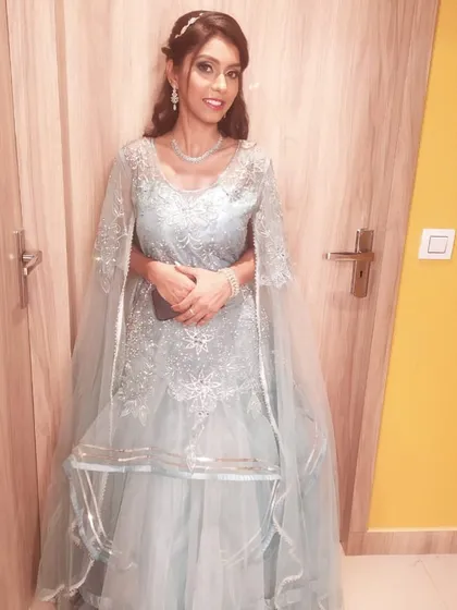 Another client in a similar powder blue rental gown, showing how popular and flattering this style is.