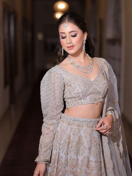 Her radiance is like the moon, serene and enchanting. For her engagement, I created a soft, glowing look with shimmery eyes and a nude lip.