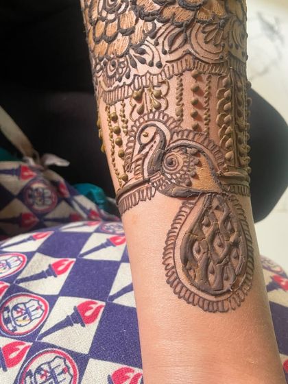 A close up of the peacock motif on the wrist. I love adding these traditional elements to my bridal designs.