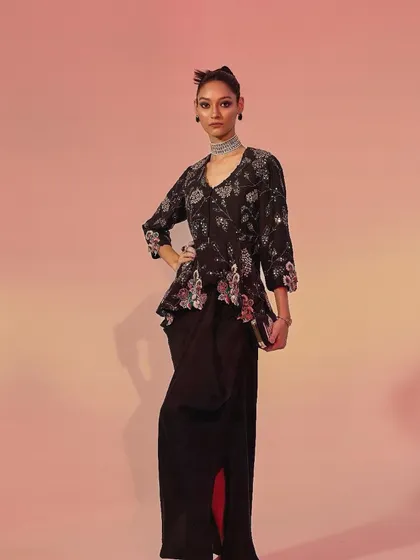 Another variation from the same collection, this time with a peplum-style embroidered top over a draped skirt. This demonstrates how I can create multiple unique looks within a single design theme.