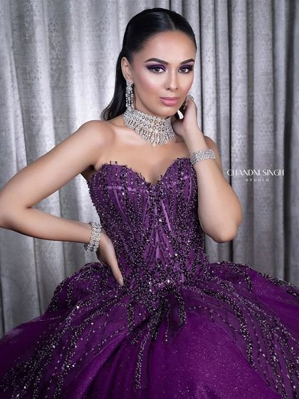 A dramatic and glamorous look taught at my academy. The purple ball gown is paired with a matching purple smokey eye, creating a high-fashion, statement look for a grand event.