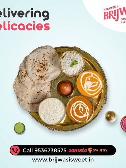 Delivering delicacies. This thali, with its variety of dishes including paneer, dal, raita, and roti, is a complete and wholesome meal.