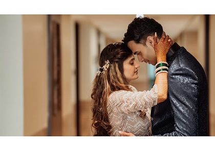 This wide, cinematic shot taken in a hotel corridor creates a feeling of a private, shared world. It’s a great example of using the location to frame an intimate moment.