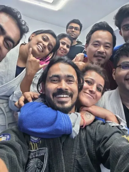 The physical connection in Jiu-Jitsu builds incredible trust and friendship. This photo is a perfect example of our family bond.
