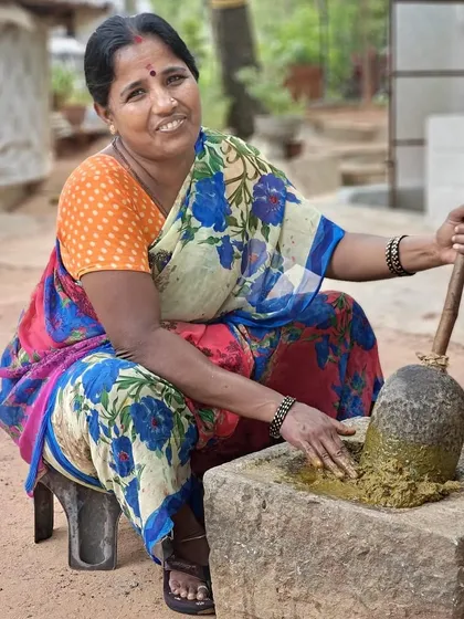 We believe in the power of nature. Here, our artisan Banu prepares a fresh batch of natural dye using traditional stone grinding methods. We use ingredients like Indian Madder and Myrobalan, ensuring our colors are earthy, organic, and gentle on the planet.