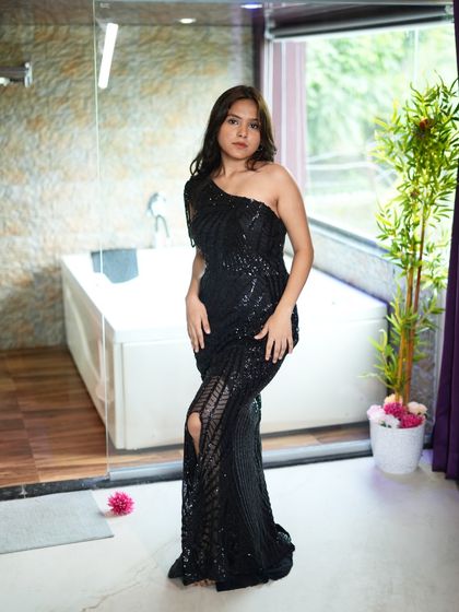 Turn heads in this stunning black one-shoulder bodycon dress. It's available for rent at my studio in Kamothe.