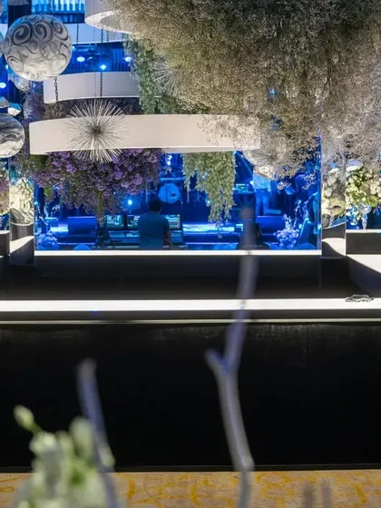 For a 'Gala Galaxy Night', I transformed the venue into a cosmos of midnight blue and icy florals. This design was inspired by the groom's love for astrophysics, featuring hand-painted orbs and a surreal play of light to create an ethereal universe.
