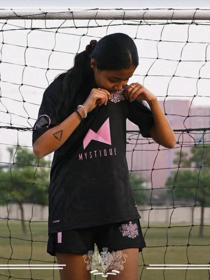 A coach and a player. Shreya, our AFC C licensed coach, proudly displaying her team jersey.