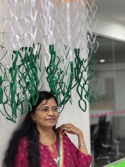 A side view of me with the finished flag, showing my pride in our collective artwork.