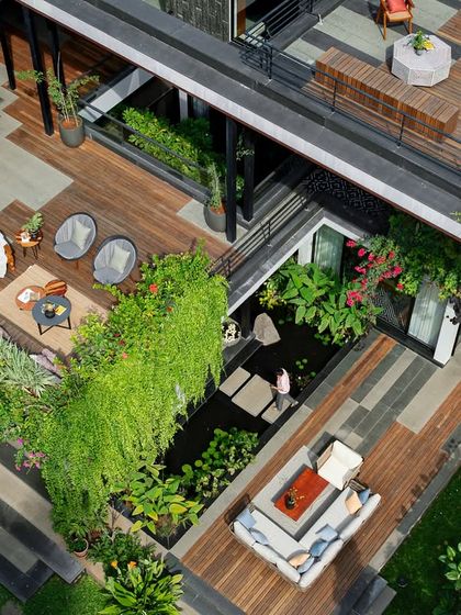 A multi-level home where every balcony and terrace overflows with greenery. This project showcases vertical gardening with cascading creepers and layered planters, creating a resort-like atmosphere that connects every part of the house to nature.