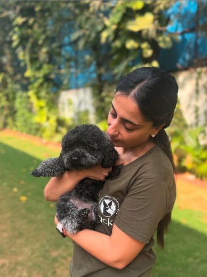 Cuddling the teeny-tiniest member of our pack, Mango the poodle. We are absolutely mutts about her.