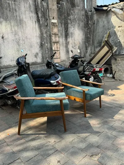 A different angle of the simple and elegant teal lounge chairs.