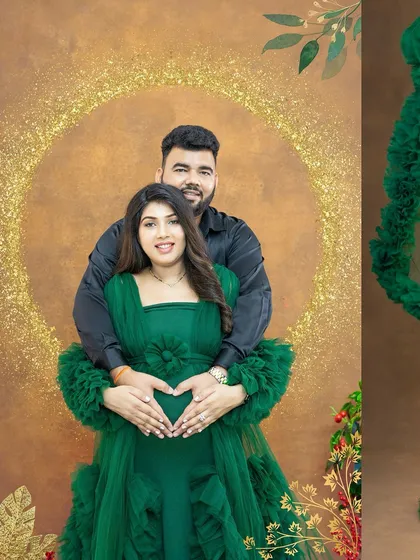 A loving embrace with both parents' hands forming a heart on the baby bump. This pose is a beautiful way to symbolize the family's love for their awaited arrival.