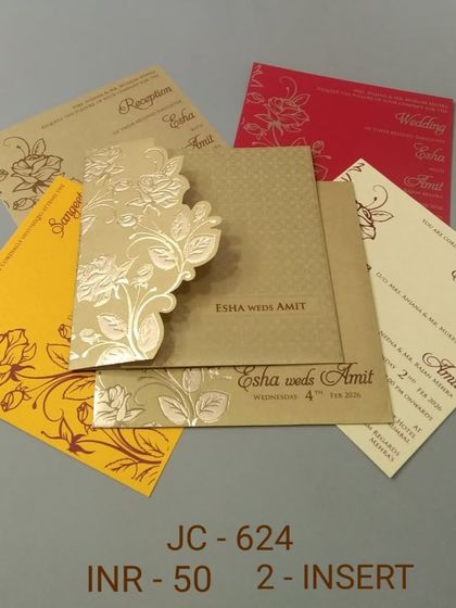 An affordable and colorful invitation set with a gold floral die-cut cover. The inserts come in a variety of bright colors like yellow and red, perfect for a lively celebration.