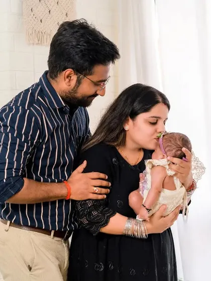 A new family's tender moment. A mother's gentle kiss for her newborn baby is a perfect expression of love, captured forever.
