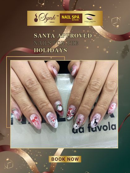 A beautiful and detailed Christmas-themed nail art set. This look combines glitter, hand-painted characters, and festive bows for a truly unique and celebratory manicure.