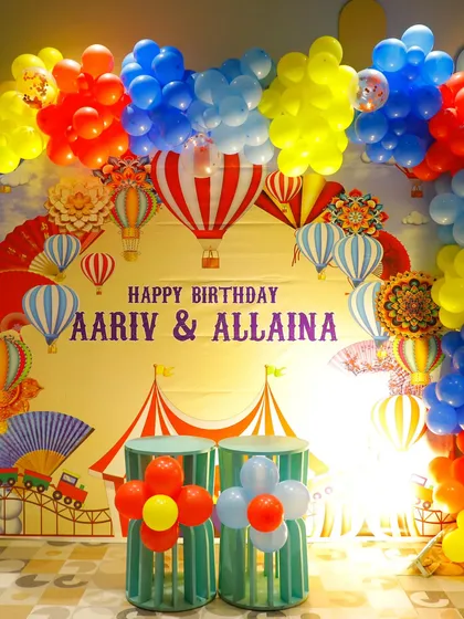 The full backdrop for a birthday carnival, featuring hot air balloons, a Ferris wheel, and circus tents. It's a vibrant and exciting theme for all ages.