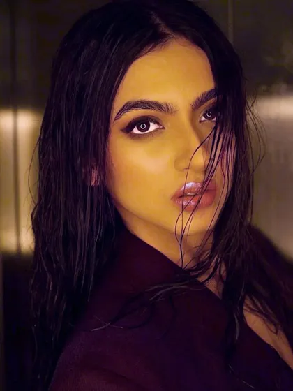 A color version of the wet look, revealing the subtle bronze and brown tones in the smokey eye and the glossy, nude-pink lip color.