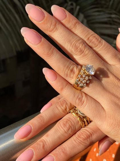 A full view of this simple and elegant sheer pink manicure.