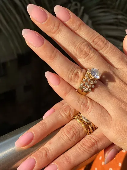 A full view of this simple and elegant sheer pink manicure.