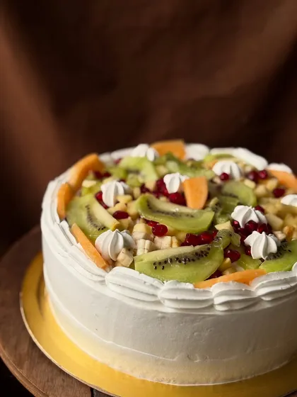 For those who love a classic, my fresh fruit cake is always a hit. I load it with seasonal fruits like kiwi, pomegranate, and cantaloupe over a light and airy fresh cream frosting.