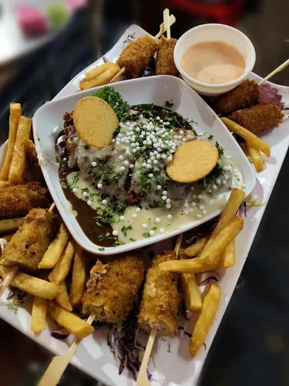 A platter of our Stuffed Chicken with Cheese Shahi Rolls. These rolls are a party favorite, served with french fries and a creamy dip.