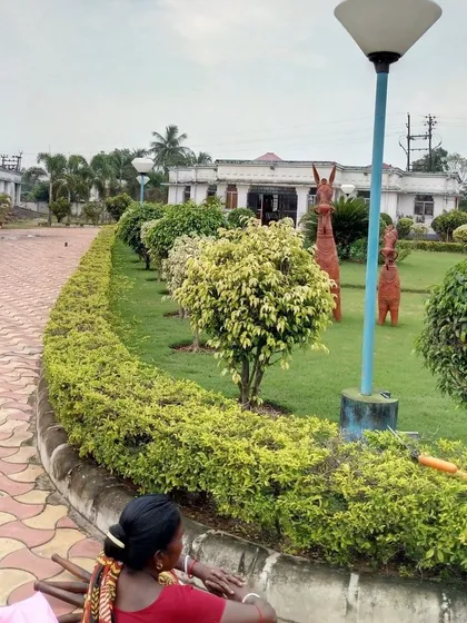 Our team maintains public parks, ensuring the hedges are trimmed, the lawn is healthy, and the space is clean and welcoming. Here, a worker is tending to the hedges.