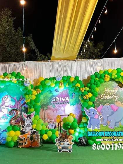 A grand jungle theme for Griva's 2nd birthday. This large setup features multiple arches and backdrops to create a dense and exciting jungle environment.