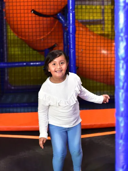 Bouncing high on our enclosed trampoline. It's a safe way for kids to burn off energy and practice their jumps.