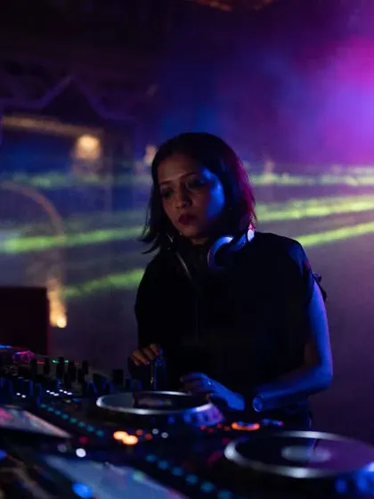 In my element, curating the journey for the dance floor. This shot was taken during a Soul Fest event, where I focus on blending tracks to build energy from the first to the last record.