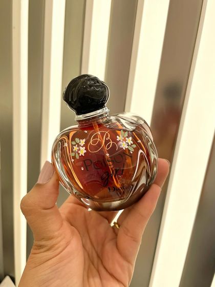 Tiny, delicate flowers painted on a Dior Poison bottle. Even the smallest details can make a big impact and transform a product.