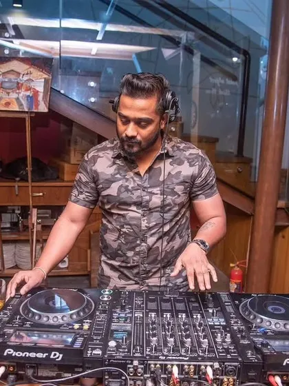 At the decks with my Pioneer setup. The nightlife is where I win, creating unforgettable nights for everyone on the dance floor.