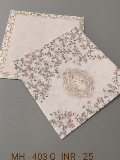 A simple and affordable card with a delicate pink floral vine pattern. This design is perfect for a spring wedding or an intimate celebration.
