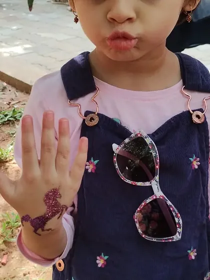 This little one is proudly showing her sparkly purple unicorn tattoo. It’s a simple design that brings so much joy and is perfect for young party guests.