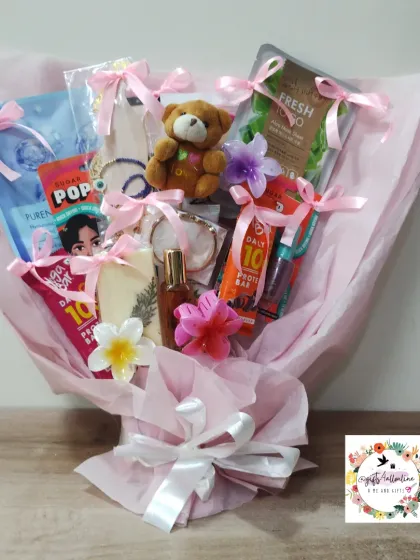 We can turn almost anything into a beautiful bouquet. This pink-themed gift bouquet for actress Helly Shah combines skincare products, a teddy bear, protein bars, and other small gifts into a stunning and practical arrangement.