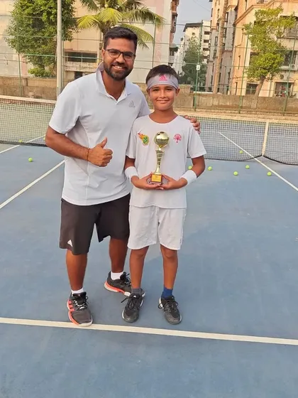Aarav Chhallani with his coach after finishing as U-12 Doubles Runner-up at the National Series in Hyderabad.
