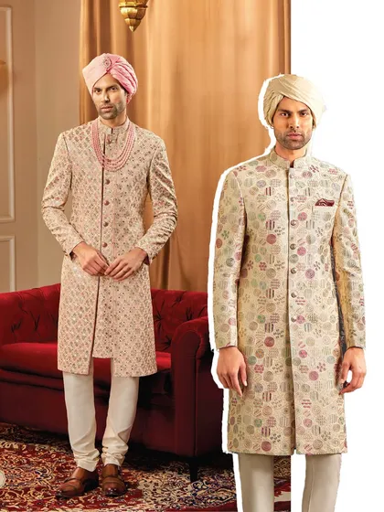 We offer a diverse palette for the modern groom. Here, we showcase two distinct sherwani styles: one in a soft pastel with a geometric pattern and the other in a multi-tonal floral design.