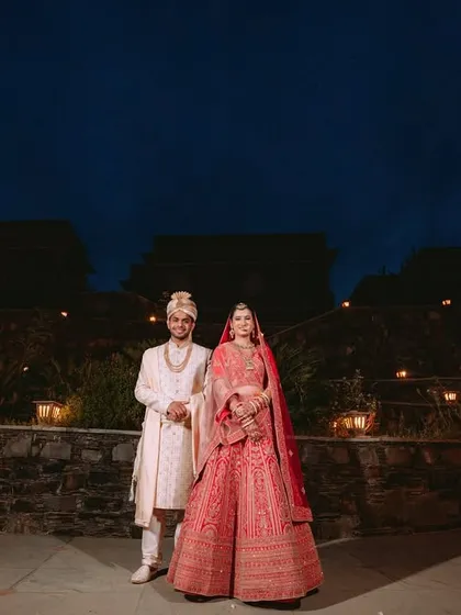 A dramatic night portrait of the couple at their destination wedding venue in Udaipur.
