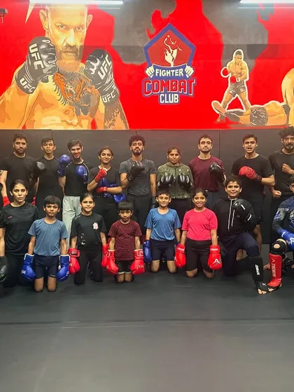 The team posing after a tough sparring session. Everyone is geared up and ready to work. This is what dedication looks like.