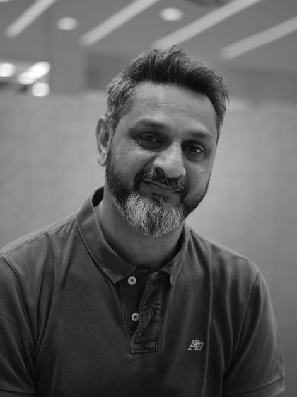 A smiling portrait that captures the confidence that comes with a great haircut.