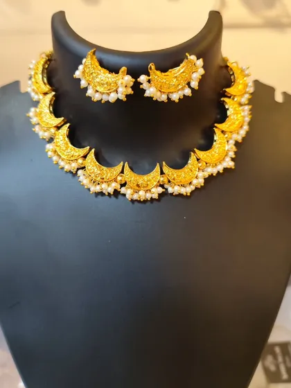 The same Chandrahaar design, but with delicate pearl drops for a softer look.
