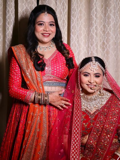 The bride and her sister, both looking radiant. I specialize in creating looks for the entire bridal party.