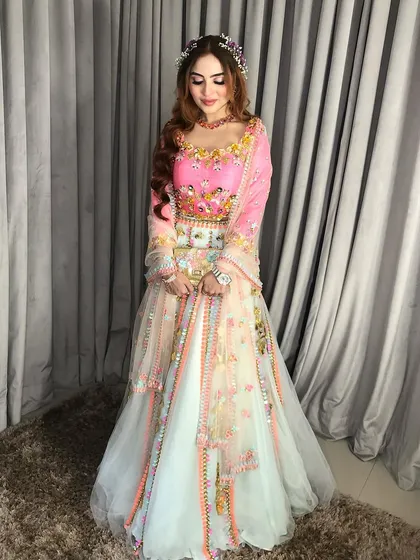 The full view of the carnival Sangeet look, with the flower crown as the centerpiece.