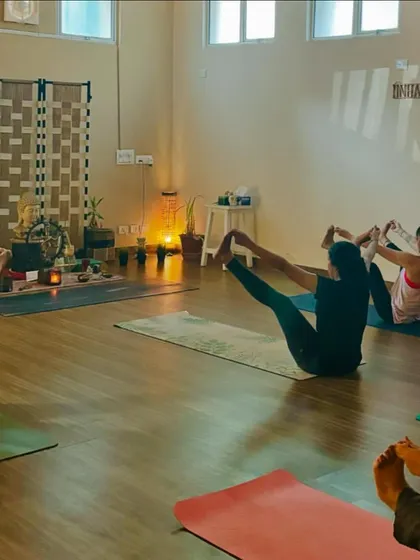 A full class working on Navasana (boat pose), a challenging posture for building core and hip flexor strength.