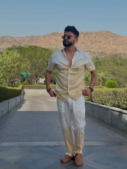 Adjusting my shirt in the two-toned outfit. It's these little actions that make for great candid shots.