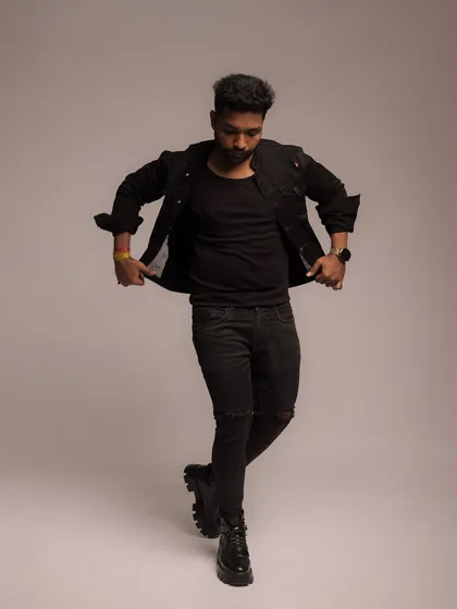 A full-length walking pose that creates a sense of motion and energy within the studio setting.