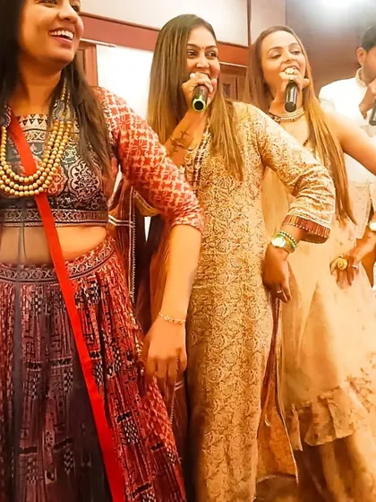 A candid moment of joy and music on stage with my team.